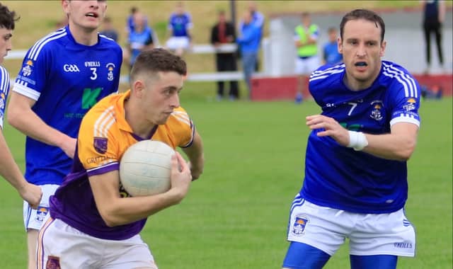 John Hand surging forward for Young Grattans with Legan Sarsfields opponent Kieran Murphy in pursuit. Action from the Intermediate Football Championship first round clash . Photo: Syl Healy