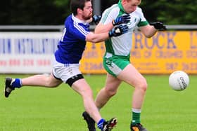 Killoe Emmet Og defender Shane Clarke in a tussle with St Mary's Granard opponent Kevin McGauran. Action from the Division 1 league game at Emmet Park on Saturday evening last. Photo: Declan Gilmore