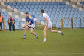 Barry McKeon on the ball for Longford against Kildare opponent Kevin Feely in the National Football League Division 3 game at Glennon Brothers Pearse Park last February.  Kildare won by 2-11 to 0-10.