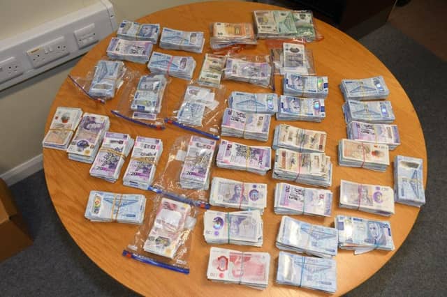 Gardaí seized £174,000 (sterling), €7000, a motor vehicle and a number of items of evidential value during a search of properties in counties Longford, Donegal, and Louth