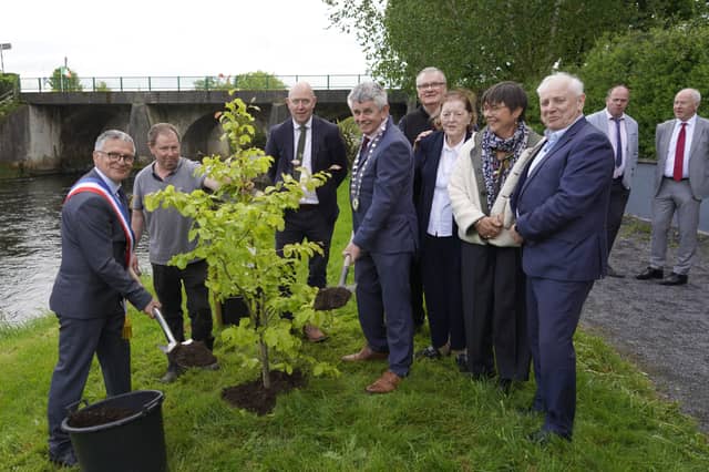 At the tree-planting ceremony in The People’s Park, Ballymahon, marking 25 years of twinning between Ballymahon and Landévant in Brittany, France, were (left to right): Mayor of Landévant Pascal Le Calvé, Derrick Healy of Creative Design Garden Centre, Cllr Paul Ross, Ballymahon Municipal District Cathaoirleach Martin Skelly, Chairperson of Landévant Twinning Claude Jean-Pierre, Chairperson of Ballymahon Twinning Breege Murray, Fabienne Le Calvé of Landévant and Cllr Pat O’Toole. At the rear are Senator Paraic Brady and Longford County Council Chief Executive Paddy Mahon.