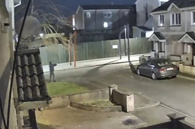 A man has been arrested for questioning in connection with a shooting that took place in Garvey's Close last February