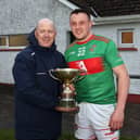 Longford GAA Chairperson Derek Fahy presenting the Johnny Skelly Cup to Colmcille captain Cathal Reilly at Fr McGee Park on Friday night last Photo: Syl Healy.