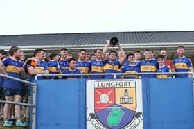 Dromard captain Fionn Hourican lifting the Patsy Reilly Cup Photo: Syl Healy 