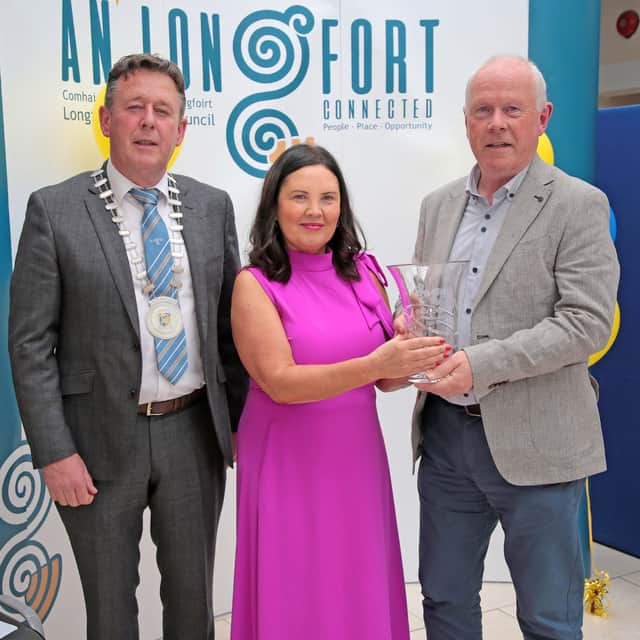 Longford County Council's Lorraine McKee and Cathaoirleach Gerry Hagan presenting Paddy with a gift to mark his retirement from Longford County Council