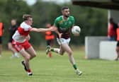 Killian Farrell (Ardagh Moydow) gets past the challenge of Colin Gilna (Abbeylara) during Friday's ​Peter Hanley Motors Longford Senior Football Championship Group A Round 2 encounter at C & D Devine Park