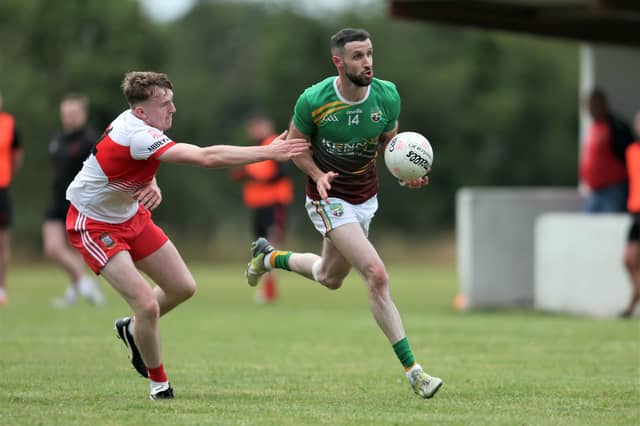 Killian Farrell (Ardagh Moydow) gets past the challenge of Colin Gilna (Abbeylara) during Friday's Peter Hanley Motors Longford Senior Football Championship Group A Round 2 encounter at C & D Devine Park