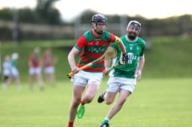 Dylan Hutchinson of Wolfe Tones is pursued by David Gregg (Clonguish Gaels) during Saturday's Cablecomm Senior Hurling Championship Round 3 clash at Michael Fay Park. Wolfe Tones triumphed by 4-20 to 1-10 to book their place in the county final on September 6 against Longford Slashers 