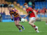 Liam Greene on the attack for Mostrim in breaking away from Grattans defender Stephen Oates. Action from the IFC semi-final on Saturday evening Photo: Syl Healy 