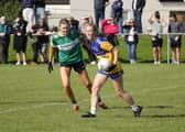 Carly Flood on the ball for Carrickedmond in this tussle with Clonguish opponent Lynn Gregg. Action from the LGFA Senior Championship semi-final at Michael Moran Park  Photo: Adam Quinn  