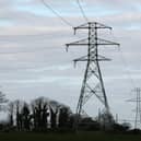 Electricity pylons in fields
