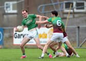 Jack Duggan on the ball for Clonguish in facing the challenge of Ardagh Moydow opponent James McGoey. Action from the recent Senior Football Championship quarter-final at Glennon Brothers Pearse Park Photo: Syl Healy 