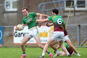 Jack Duggan on the ball for Clonguish in facing the challenge of Ardagh Moydow opponent James McGoey. Action from the recent Senior Football Championship quarter-final at Glennon Brothers Pearse Park Photo: Syl Healy 