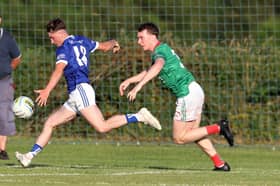 Granard minor Brendan Martin Burns on the attack for St Mary’s ahead of Colmcille defender Eoghan Williams in the opening round of this year’s senior football championship 
Photo: Syl Healy 