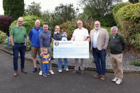 Club Longford members Mark Connellan, Longford GAA Chairperson Derek Fahy, Brendan McLoughlin, Club Longford Chairperson Derek Sheridan and  Cllr Martin Skelly present the prize winning cheque of €50,000 to lucky winners Johnny, Ann, JJ and Baby Shea Keegan, Carrickedmond.