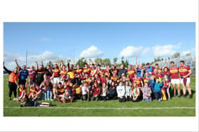 The victorious Fr Manning Gaels squad celebrate their Junior 'C' title triumph with mentors and family members Photo: Syl Healy