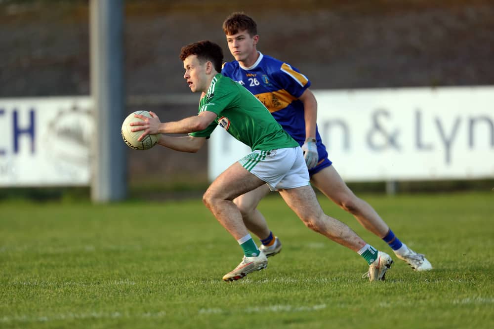 Cormac Flynn on the attack for Clonguish in his bid to evade the challenge of Dromard opponent Padraig Mulligan. Action from the Senior Football Championship semi-final replay Photo: Syl Healy 