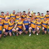 The Carrickedmond players celebrate their win over Colmcille in the Junior ‘B’  championship final  Photo: Syl Healy 