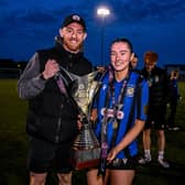 Melissa O'Kane of Athlone Town celebrates with her partner, and Dundalk FC goalkeeper, Enda Minogue, and the SSE Airtricity Women's Premier Division trophy 