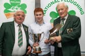 Congratulations to Daniel Haughey from Barne, Edgeworthstown, Under 28 National Ploughing Champion receiving an NPA Perpetual Cup from NPA Chairman; John Deery and an NPA Trophy from NPA President; Mick Mahon, at the Ploughing 2026 awards in Tullamore, last Sunday, October 4