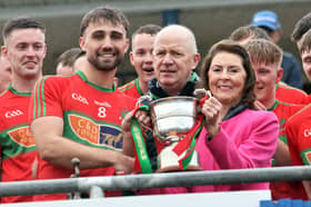 Mostrim captain Jack Belton receiving the Gerry Hennessy Cup from Anne Hennessy and Longford GAA Chairperson Derek Fahy. The Edgeworthstown club overcame Sean Connolly’s on a 1-17 to 1-11 scoreline in the Intermediate Football Championship Final at Glennon Brothers Pearse Park on Sunday last   Photo: Syl Healy 
