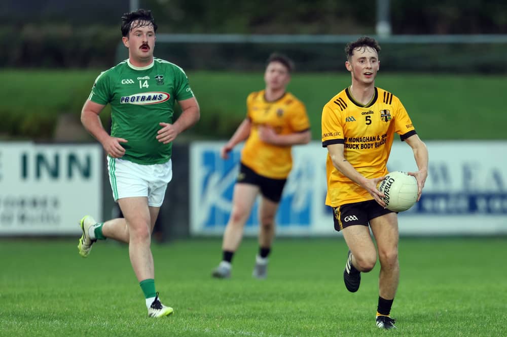 Gavin O’Hara on the ball for Ballymore in breaking away from Clonguish opponent Josh Sorohan. Action from the group stage clash in the Junior ‘A’ Football Championship with Ballymore winning by 1-18 to 3-7 at Allen Park  Photo: Syl Healy 
