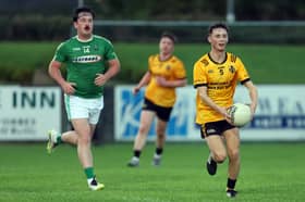 Gavin O’Hara on the ball for Ballymore in breaking away from Clonguish opponent Josh Sorohan. Action from the group stage clash in the Junior ‘A’ Football Championship with Ballymore winning by 1-18 to 3-7 at Allen Park  Photo: Syl Healy 