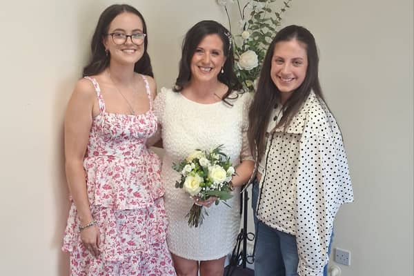 Tona Clabby pictured on her wedding day with her daughters Abbey and Grace​
