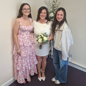 Tona Clabby pictured on her wedding day with her daughters Abbey and Grace​