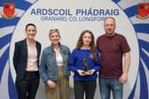 Award winning athlete Erin pictured at this years awards ceremony with her parents, Clare and Joe, and school coach, Ms Magan. 