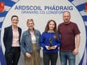 Award winning athlete Erin pictured at this years awards ceremony with her parents, Clare and Joe, and school coach, Ms Magan. 