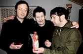 Irish singer-songwriter Shane MacGowan, the original lead vocalist of the Pogues, flanked by brothers Johnny Cronin and Mick Cronin