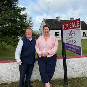 ​Longford auctioneer John Columb pictured with presenter of RTÉ’s Cheap Irish Homes, Maggie Molloy