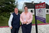 ​Longford auctioneer John Columb pictured with presenter of RTÉ’s Cheap Irish Homes, Maggie Molloy