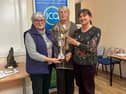 Kenagh Guild members Myrtle Kenny and Karen McLoughlin receiving the cookery cup from Contest secretary Nuala McLoughlin
