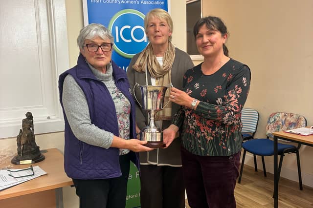 Kenagh Guild members Myrtle Kenny and Karen McLoughlin receiving the cookery cup from Contest secretary Nuala McLoughlin