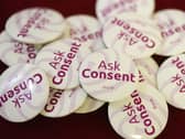 Badges with the words 'ask consent' on the front