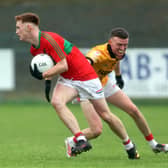 James Connell on the ball for Mostrim in evading the challenge of Sean Connolly’s opponent Alan Gregg. Action from the recent Intermediate Football Championship final Photo: Syl Healy  