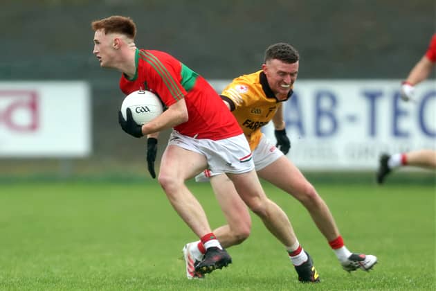James Connell on the ball for Mostrim in evading the challenge of Sean Connolly’s opponent Alan Gregg. Action from the recent Intermediate Football Championship final Photo: Syl Healy  