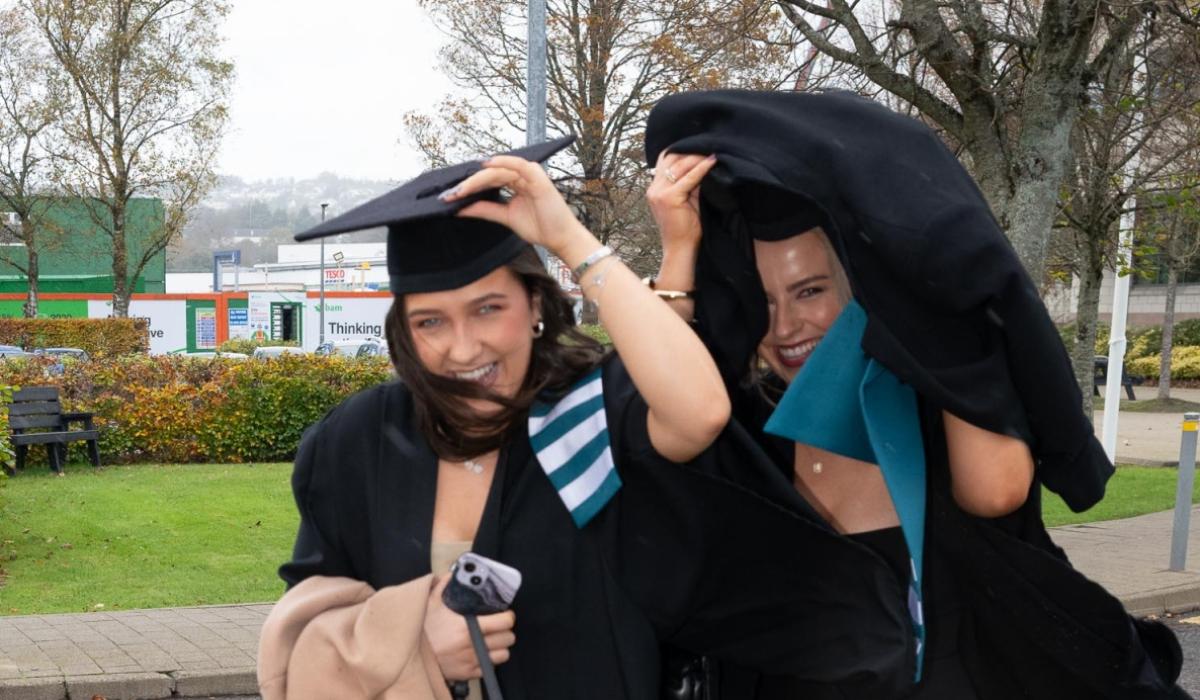 Smiling in the rain! Longford graduate takes shelter from a torrential Donegal downpour