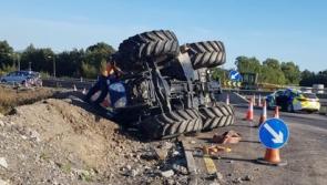 Tractor driver has lucky escape after toppling vehicle on motorway