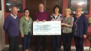 Monster Bingo team present cheque to Meals on Wheels Longford