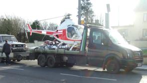 Gardai stop helicopter being transported through Irish village 