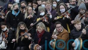 Tin whistles and tears, as thousands gather for funeral of Ashling Murphy