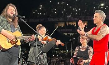 Longford Fiddle player Laura Doherty on stage last night with Robbie Williams and Garron Noone in Croke Park Picture: Facebook Fleadh Cheoil Longfoirt