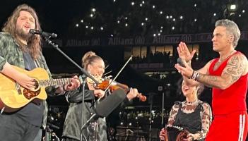 Longford Fiddle player Laura Doherty on stage last night with Robbie Williams and Garron Noone in Croke Park Picture: Facebook Fleadh Cheoil Longfoirt
