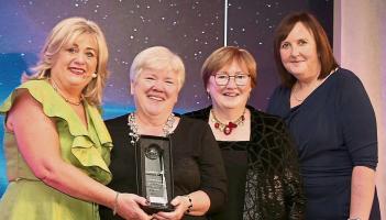 Kane's Travel receiving award