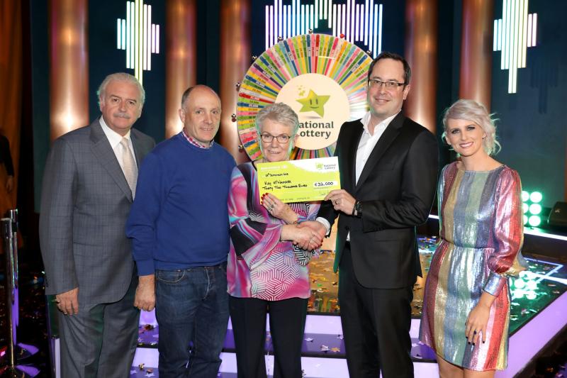 Kay McNamara from Granard with Marty Whelan and Sinead Kennedy Winning Streak presenters, Brett Cross National Lottery and Padraig McNamara, Granard Post Office , Kay's son, and ticket selling agent