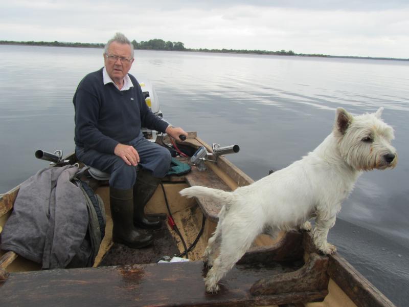 P Farrell and his dog Whiskey enjoying a fishing trip