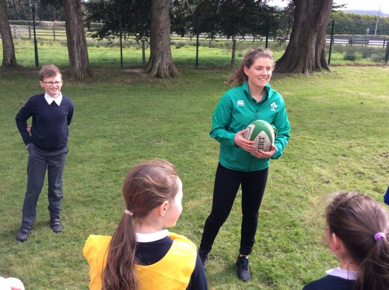 Irish rugby star Ellen Murphy pictured with some of the students